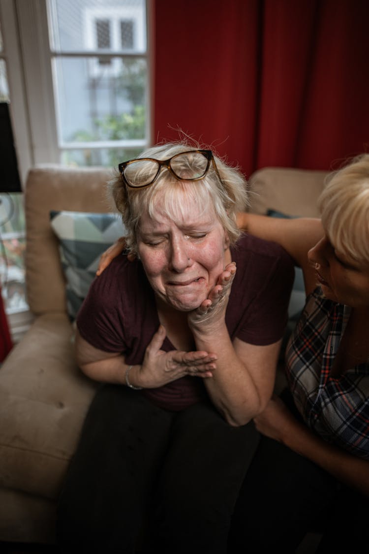 A Woman Consoling An Emotional Friend