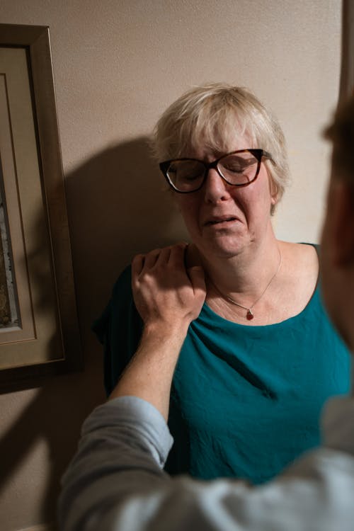 Woman in Teal Scoop Neck Shirt Wearing Black Framed Eyeglasses