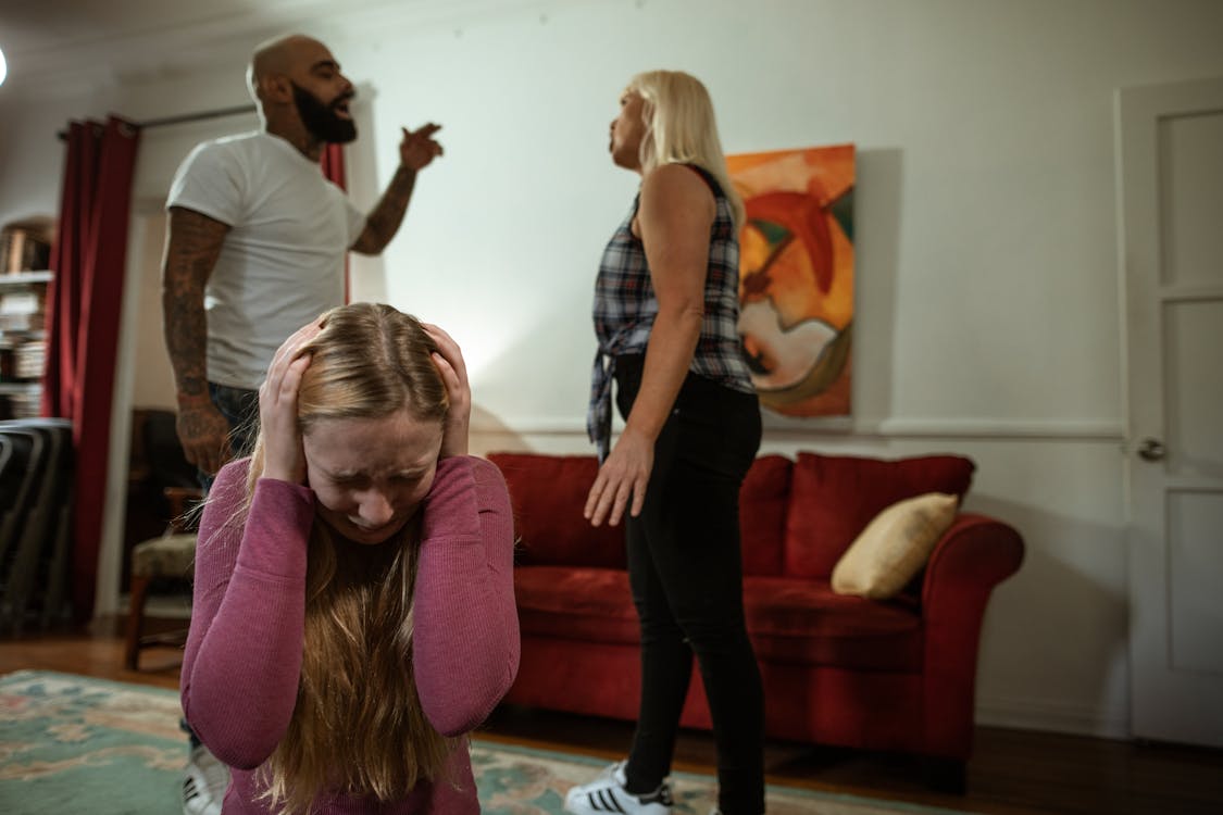 Free Parents Arguing in Front of a Child Stock Photo