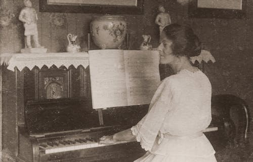  Woman in White Dress Playing The Piano