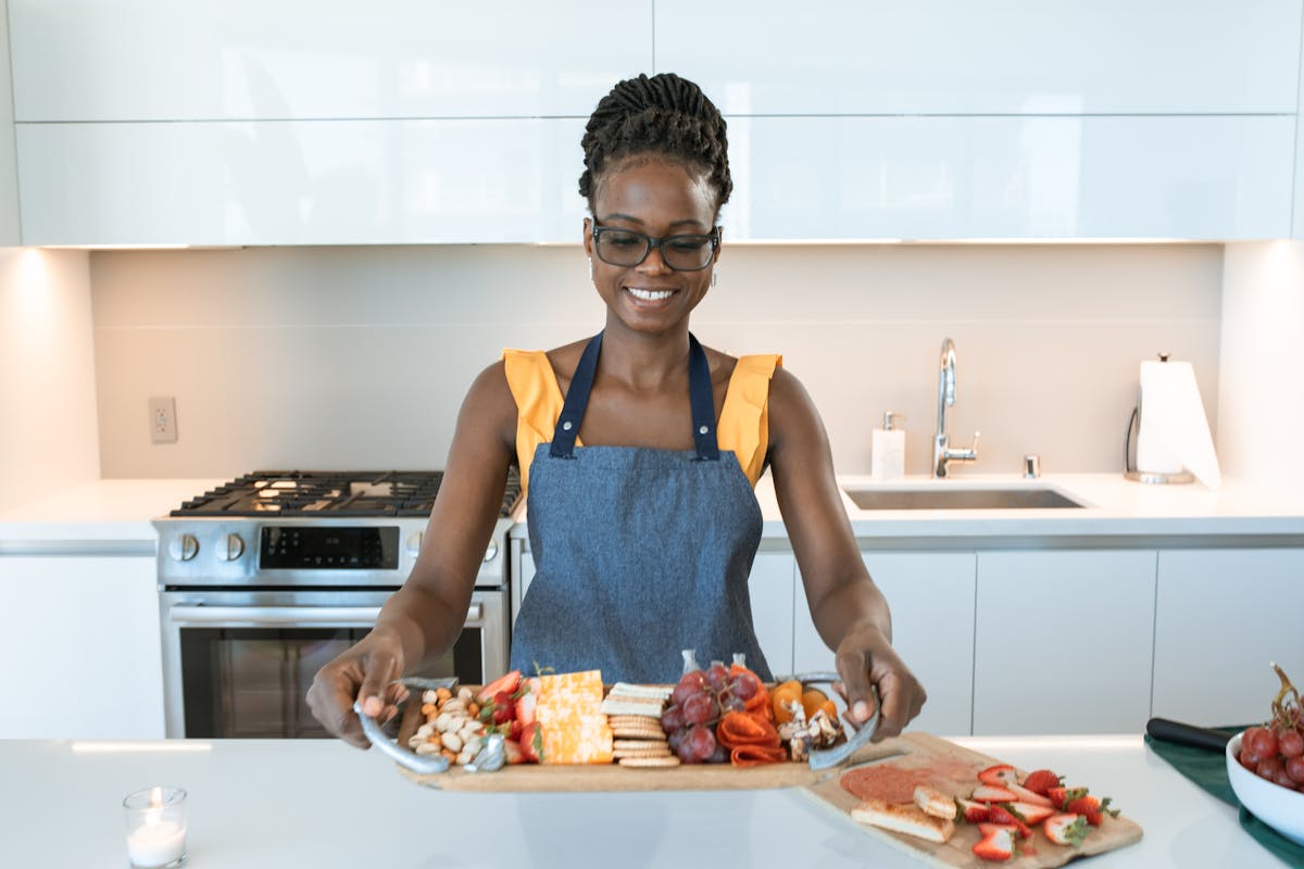 Woman in Blue Tank Top Wearing Black Framed Eyeglasses