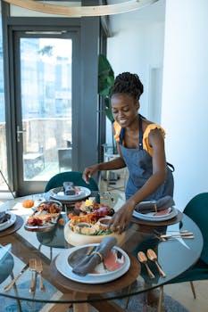Smiling woman arranging a table with a homemade meal indoors.