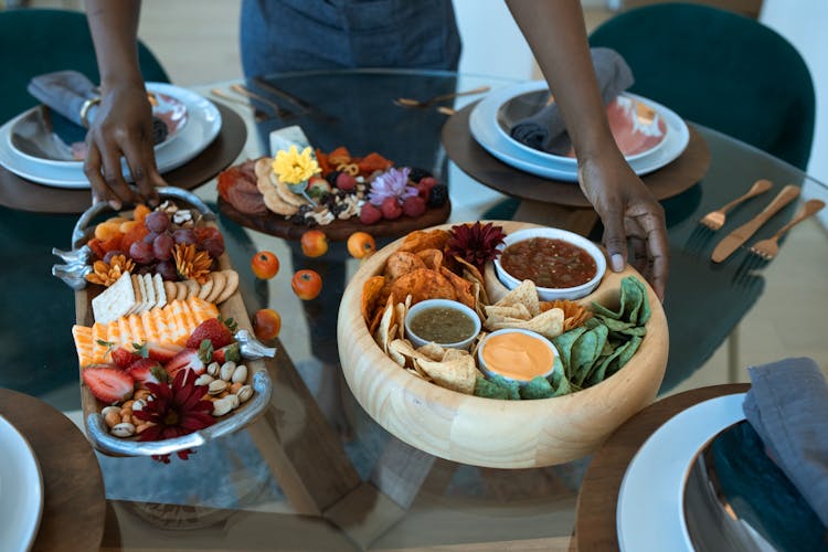 A Person Holding A Food Platter