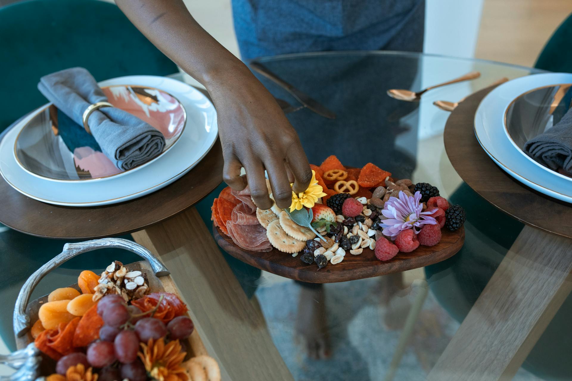 Person Holding Brown and Red Fruit