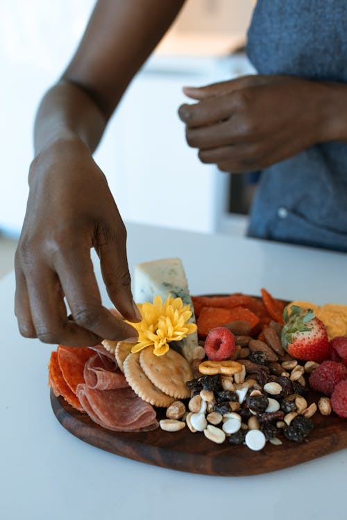 A Person Preparing a Food Platter