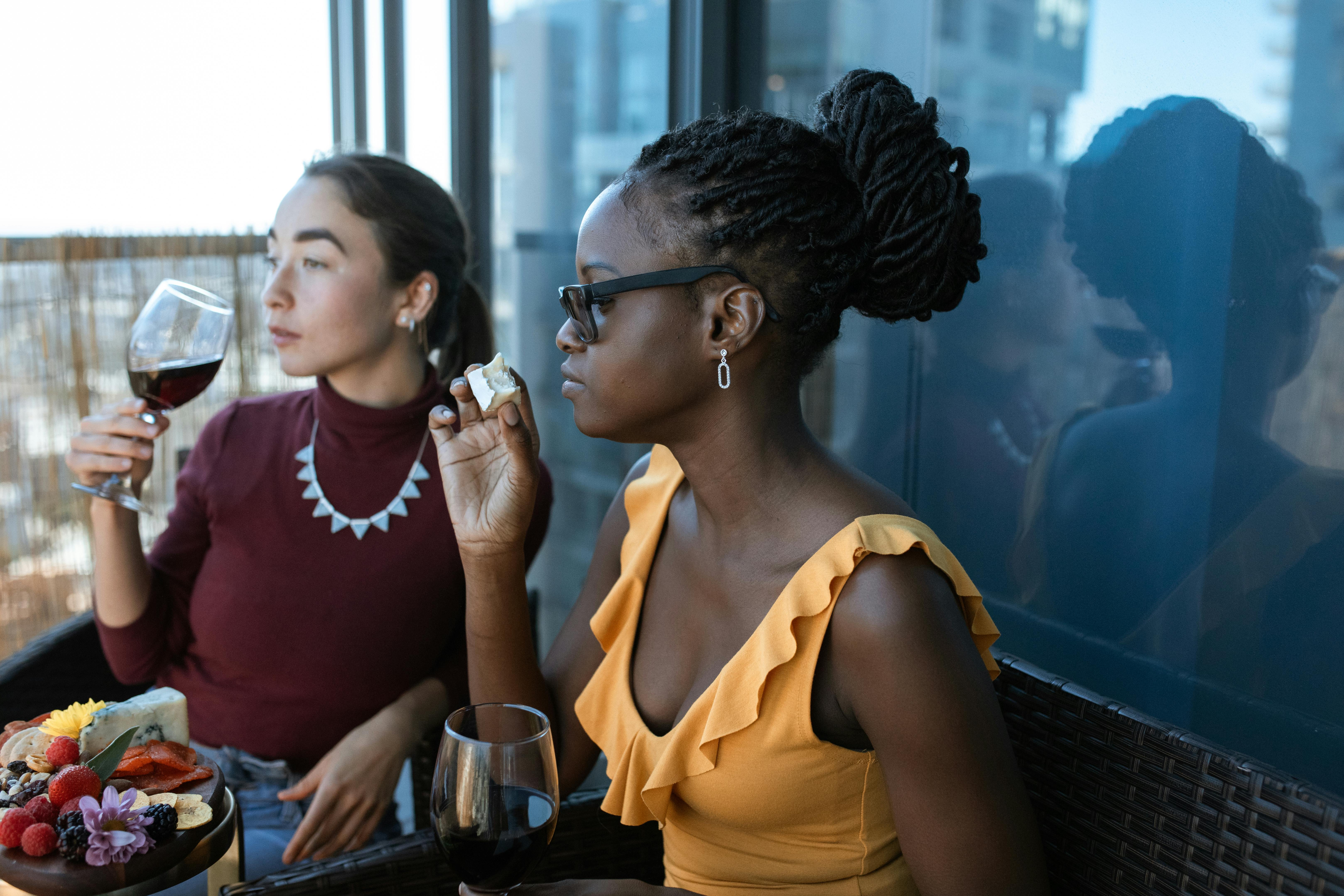 City Winery's waterfront seating with wine glasses and cheese board - chicago riverwalk dining