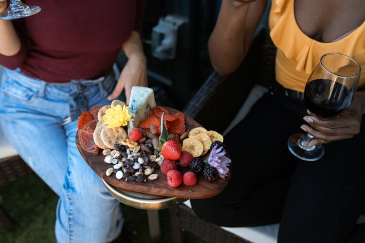 Two Women Sharing A Grazing Board