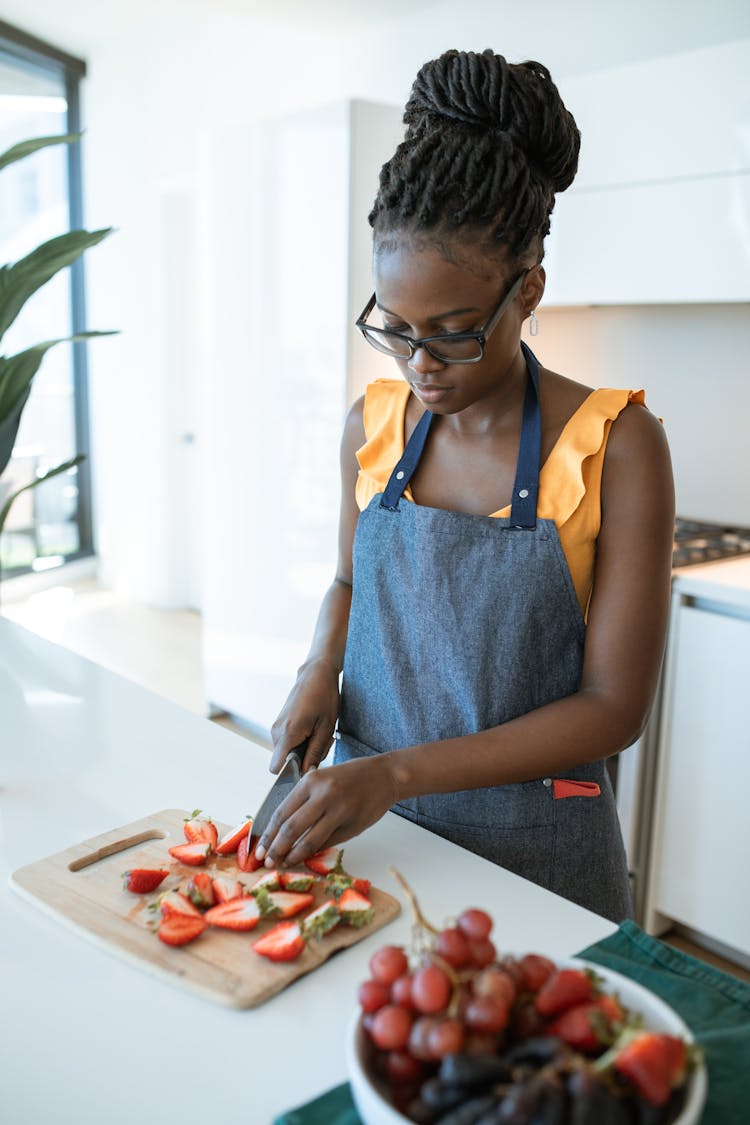 Woman Slicing Strawberries