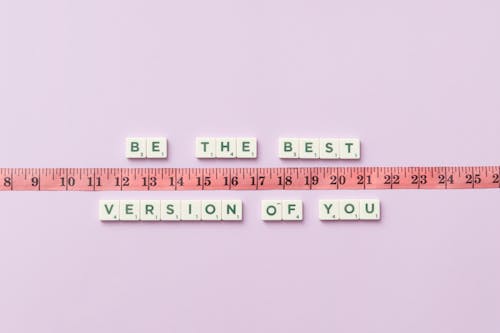 A Phrase and a Measuring Tape on a Purple Background