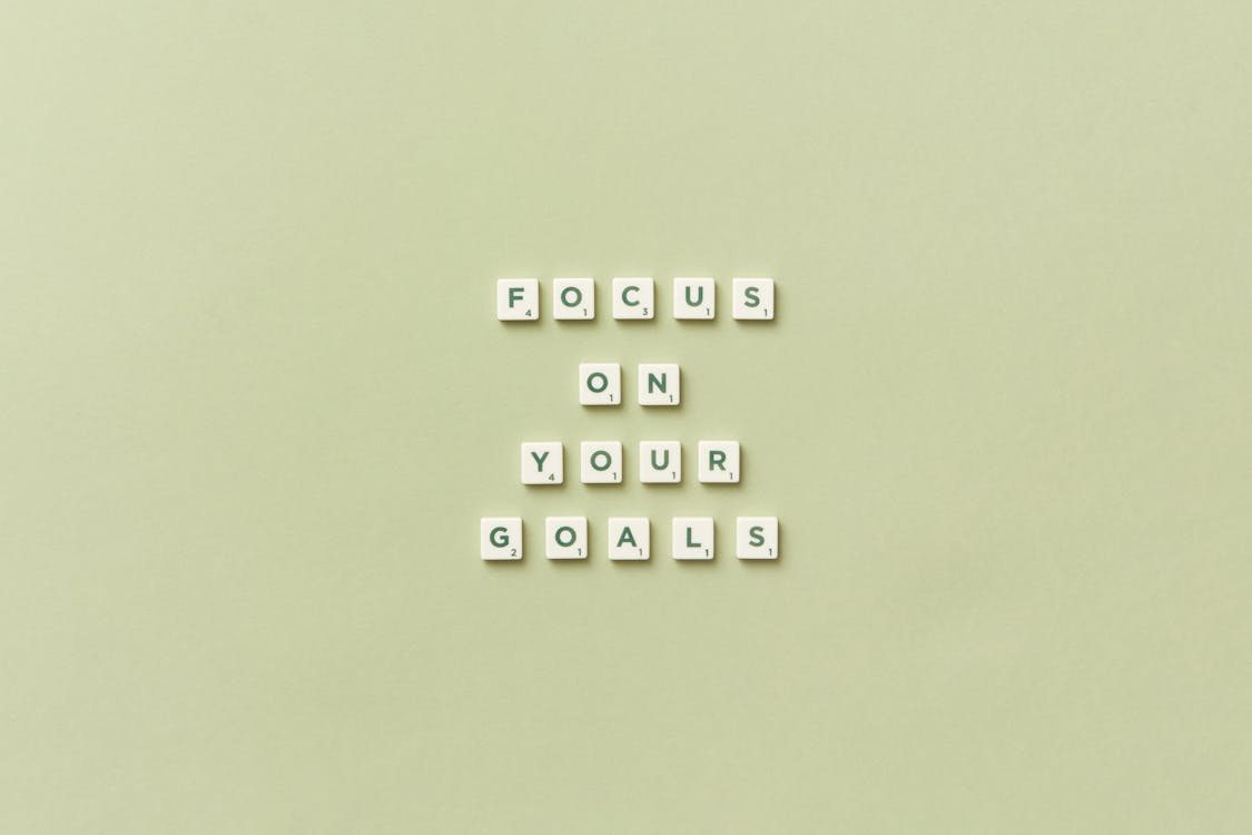 Free Sentence Focus on Your Goals Arranged with Scrabble Tiles Stock Photo