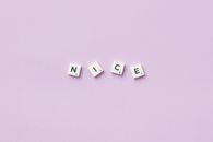 Scrabble Pieces on Purple Background