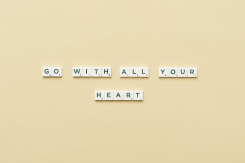 A Motivational Phrase Spelled with Scrabble Tiles