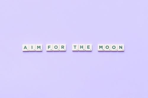 A Motivational Phrase Spelled with Scrabble Tiles