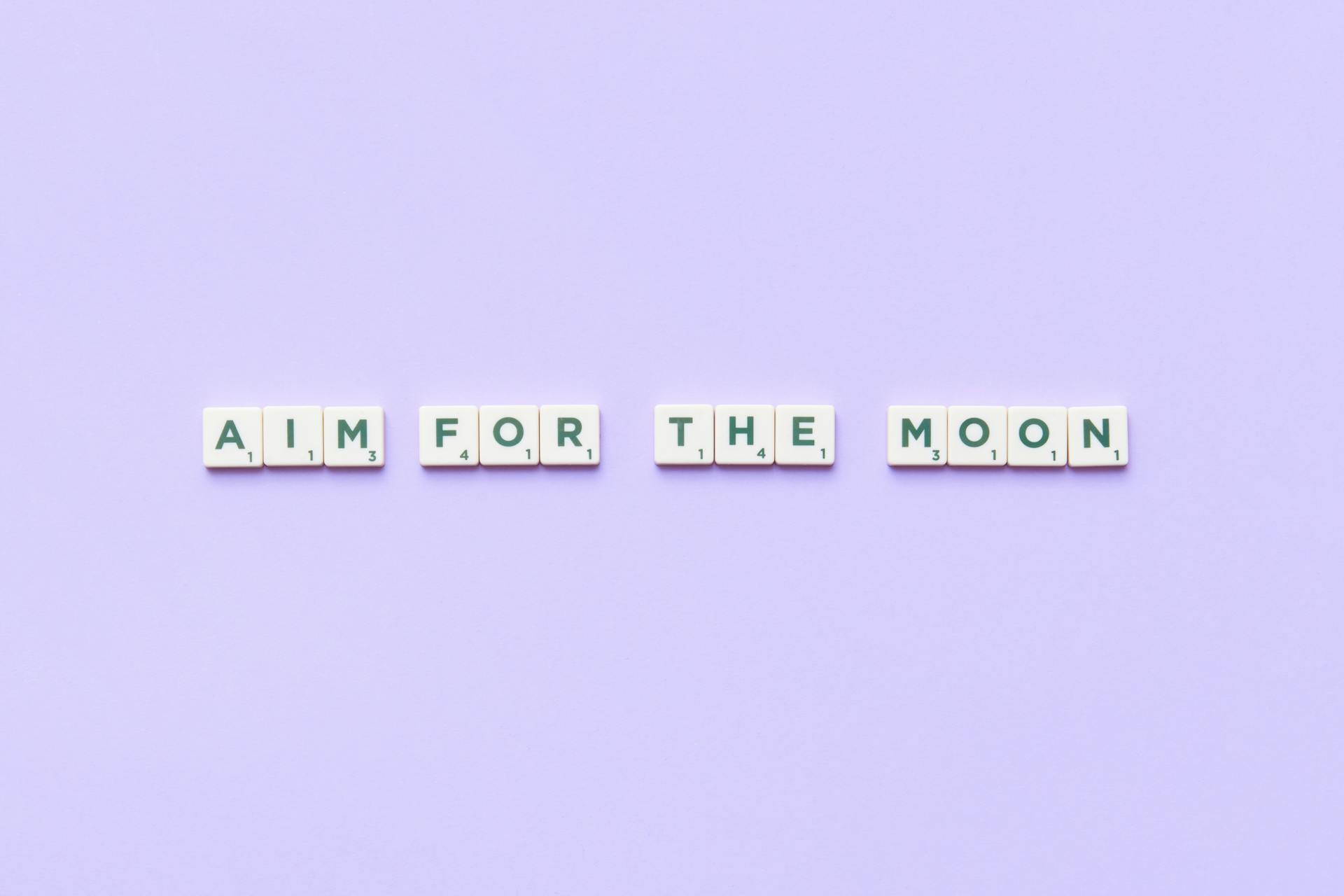 A Motivational Phrase Spelled with Scrabble Tiles