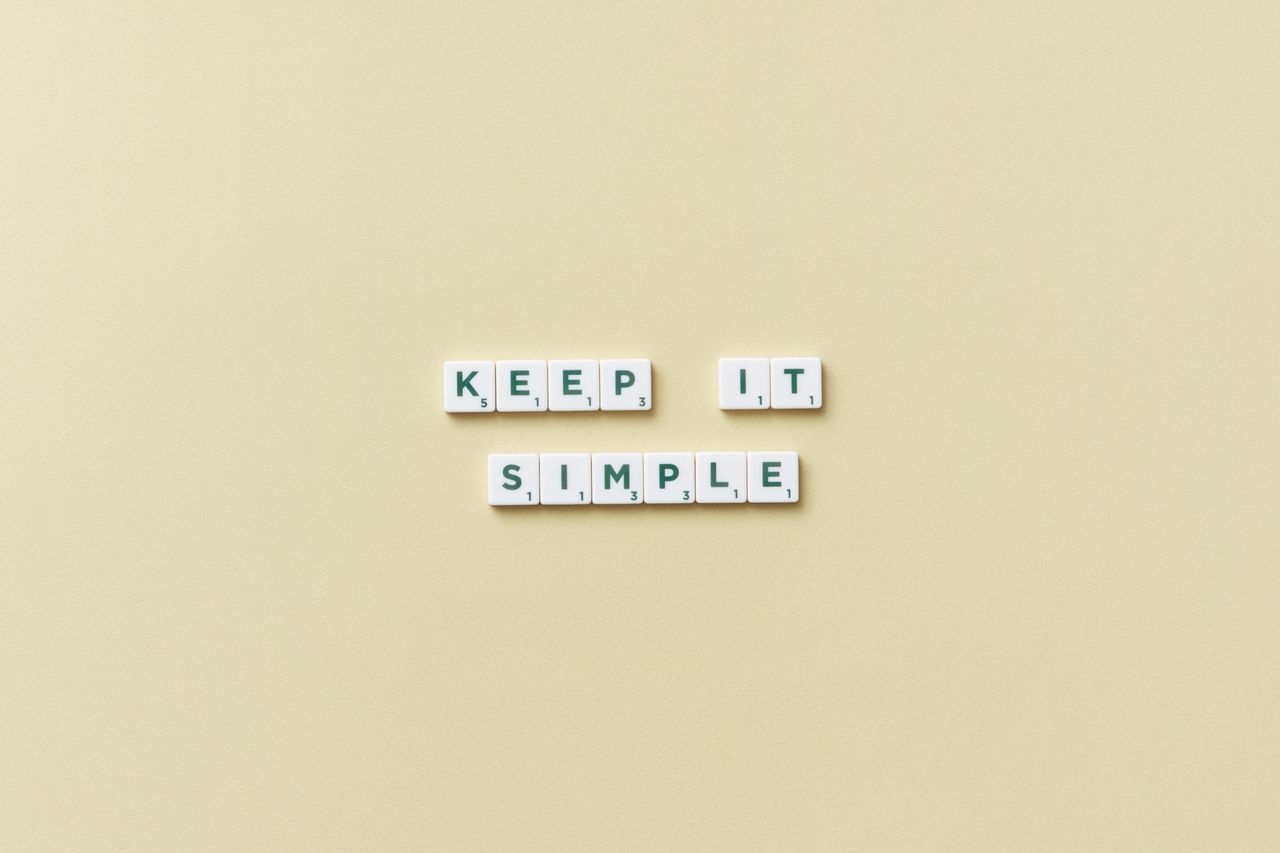 simple message with scrabble tiles on a pastel background promoting mi