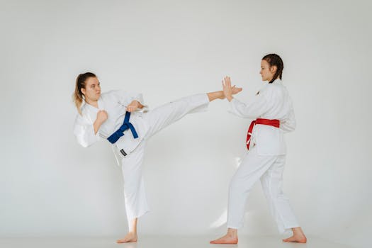 Girls in Uniforms Practicing Karate