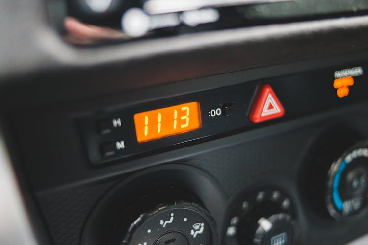 Electronic Clock On Dashboard Of Car