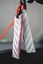 Decorative plastic sticks with label of designed fashion clothes in car against blurred background in daytime