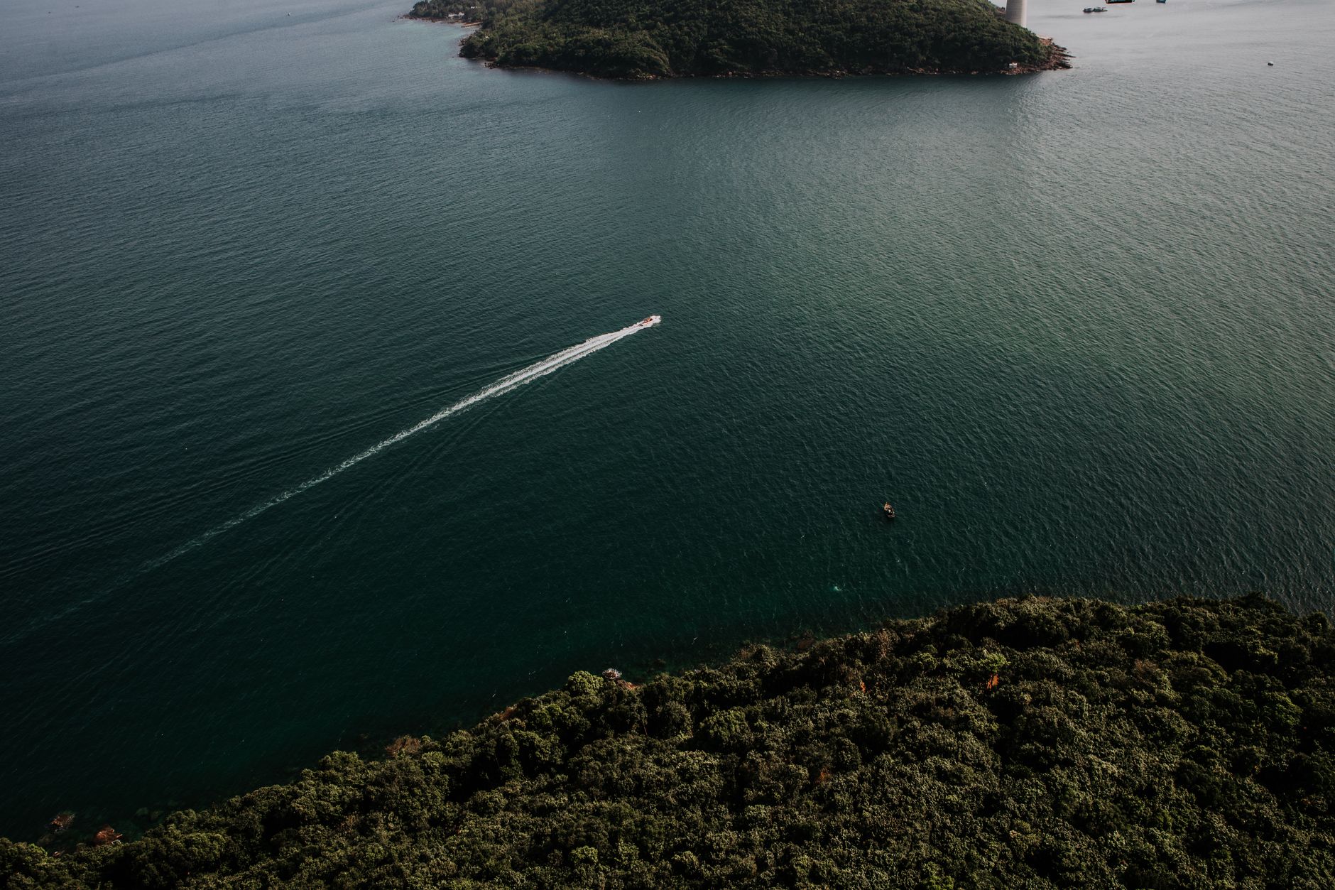 A stunning aerial view showcasing the serene coast and vibrant waters of Vietnam.