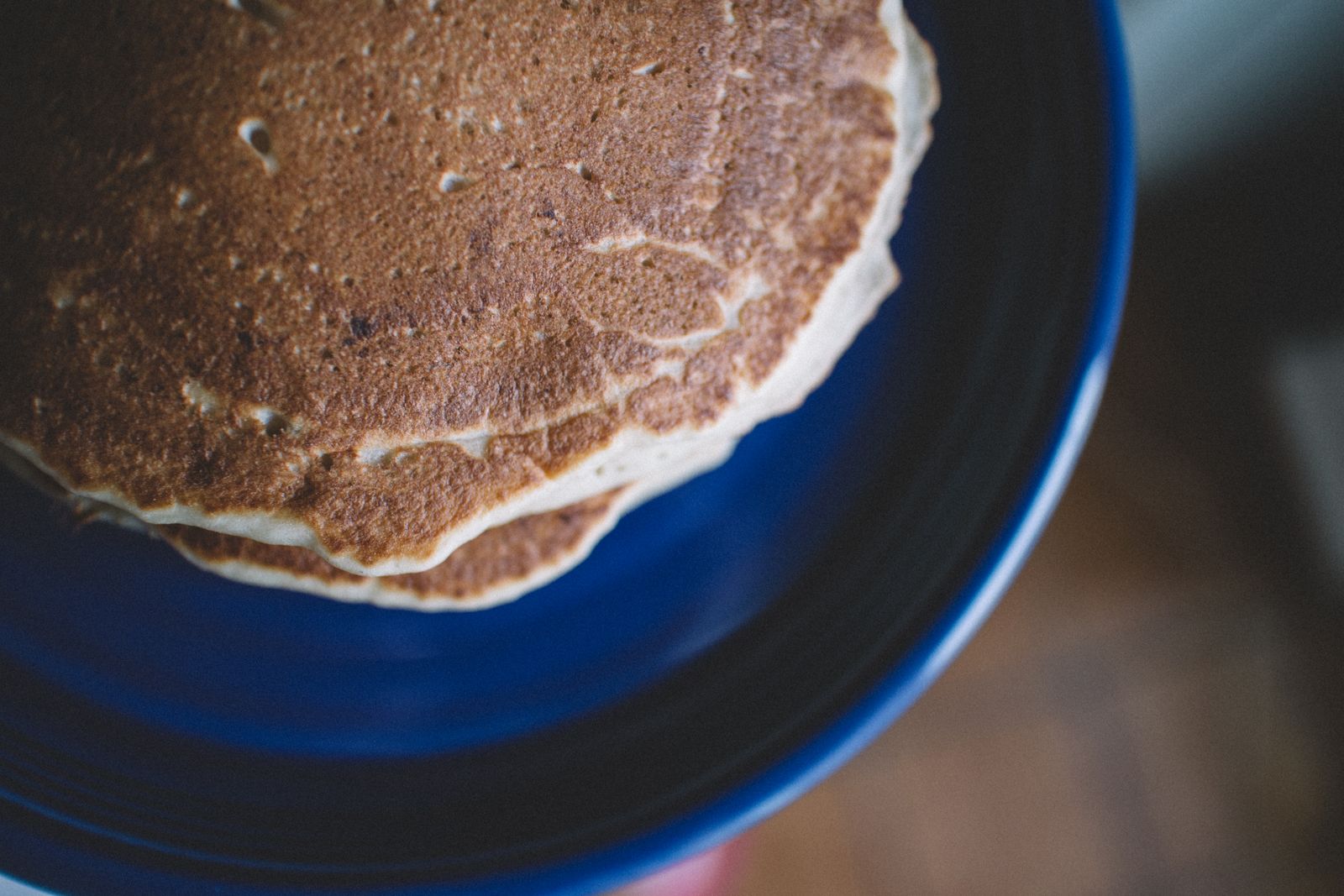 Stack of golden pancakes on a plate ready to serve for breakfast