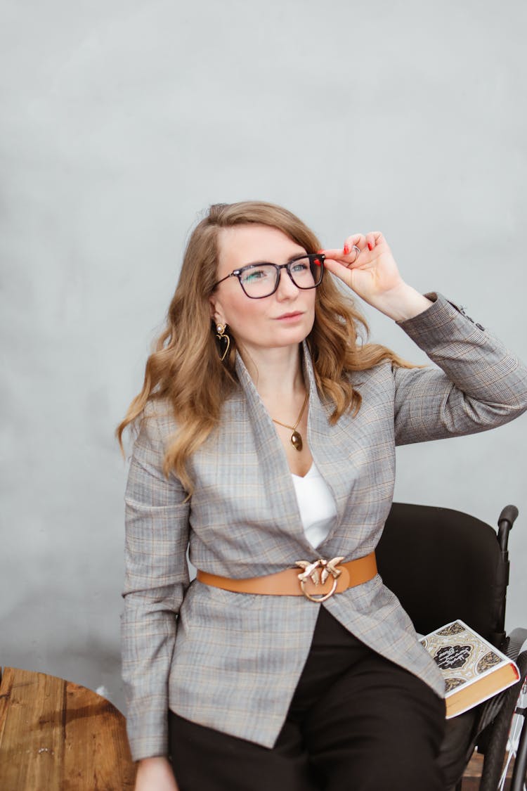 Woman In Plaid Blazer Wearing Black Framed Eyeglasses