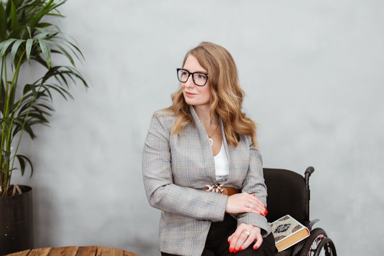 Woman Wearing Plaid Blazer And Black Pants 