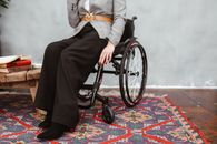 Man in Black Pants Sitting on Wheel Chair