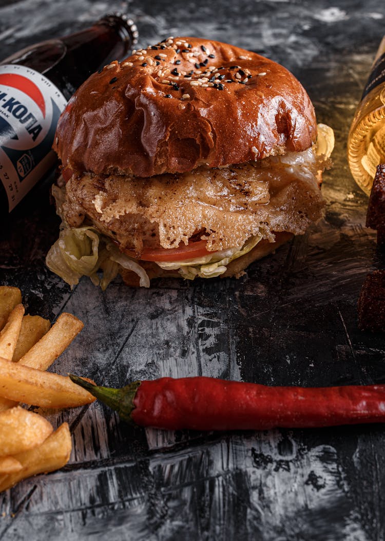 Tasty Burger And Fries On Gray Table