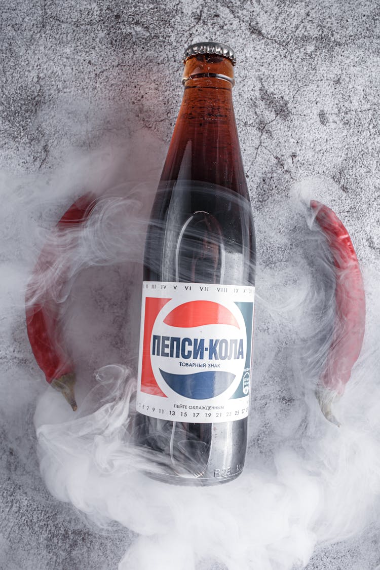 Bottle Of Fizzy Drink In Smoke Of Dry Ice