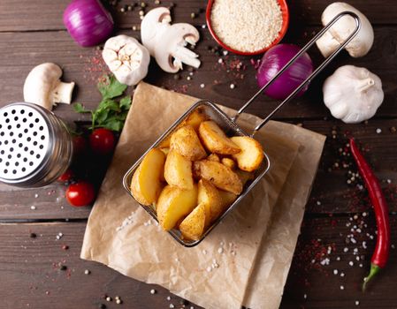 Potato wedges placed on table amidst various seasonings