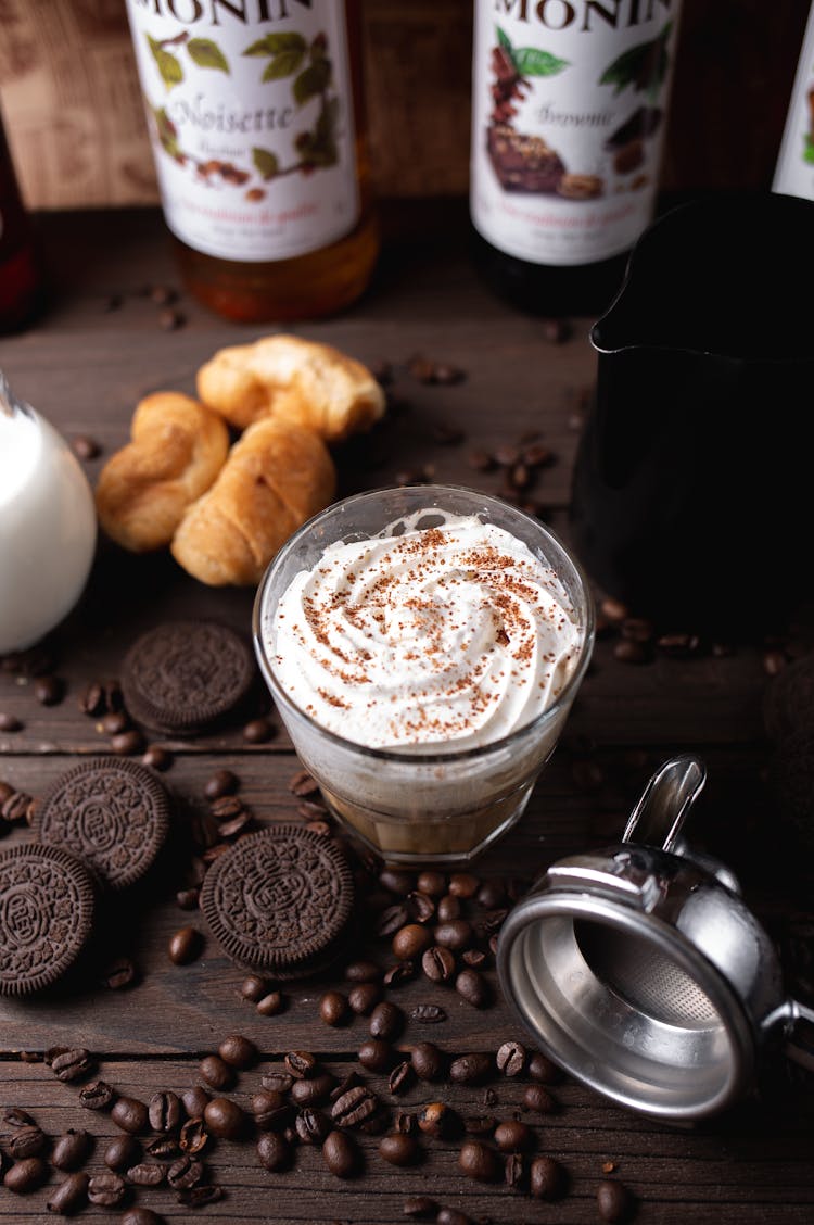 Cup Of Coffee With Whipped Cream On Table