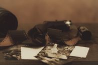 Black Dslr Camera on White Paper