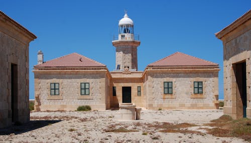 Lighthouse Tower with Surrounding Buildings in Traditional Architecture