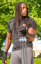 Man in Black T-shirt With Brown and White Scarf