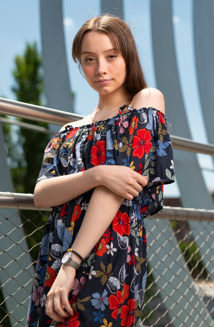 Woman Posing With Her Hand Touching Her Elbow 