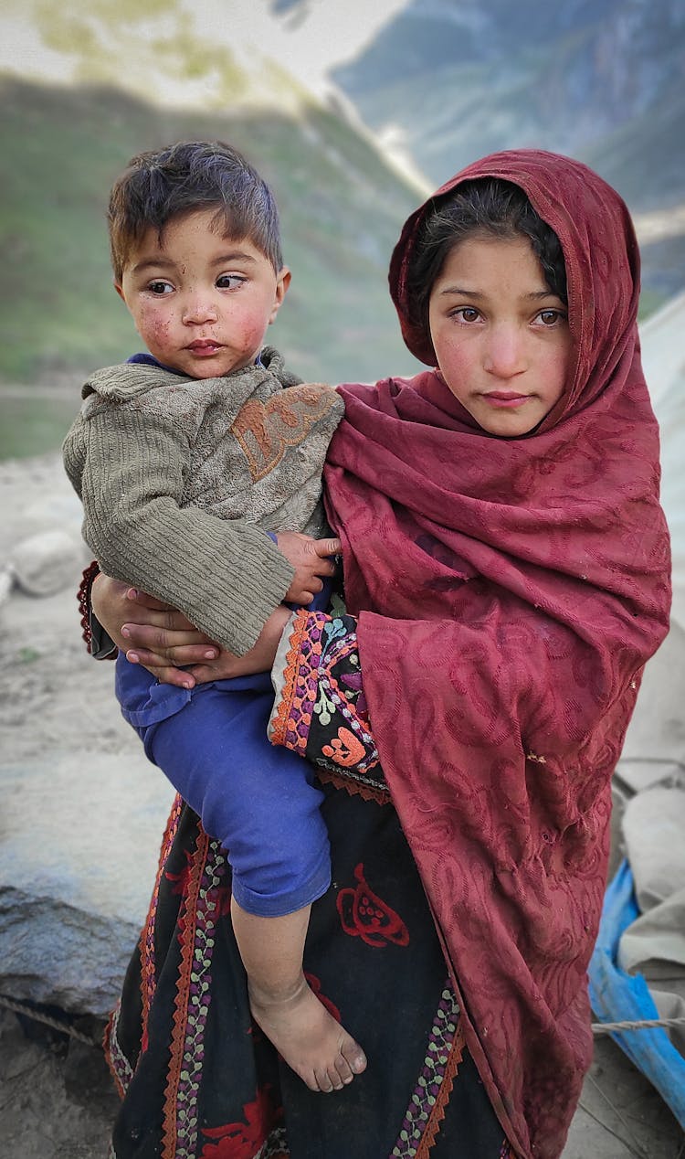 Woman Carrying A Toddler