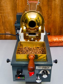 Detailed close-up of a coffee roasting machine with freshly roasted coffee beans in Madrid.