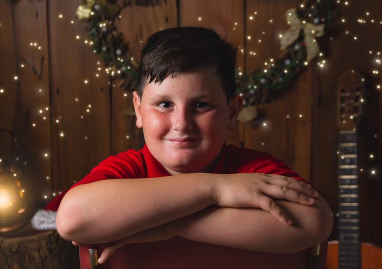 Portrait Of Boy In Christmas Scenery