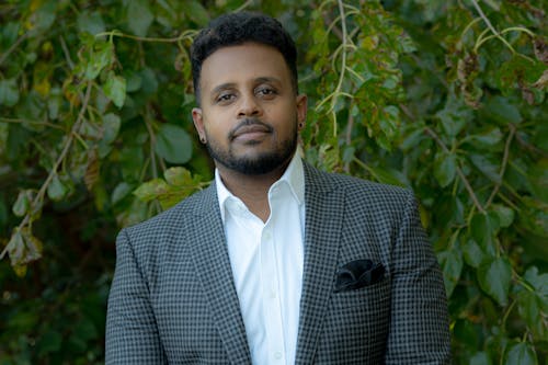 A Bearded Man in Checkered Suit