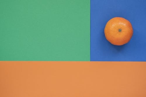 Orange Fruit on Colored Paper 
