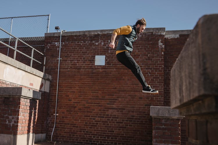 Brave Man Jumping On Roof