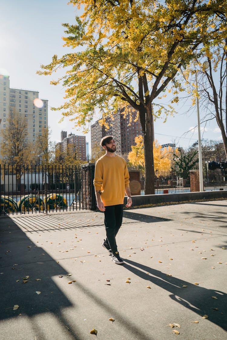 Man Walking On City Street Alone