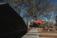 Fit man preparing to jump from brick wall