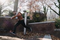 Young man running fast in park