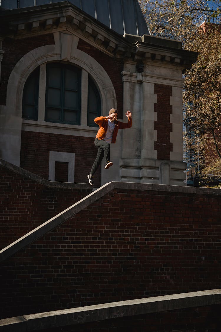 Fearless Man Jumping Above Banister