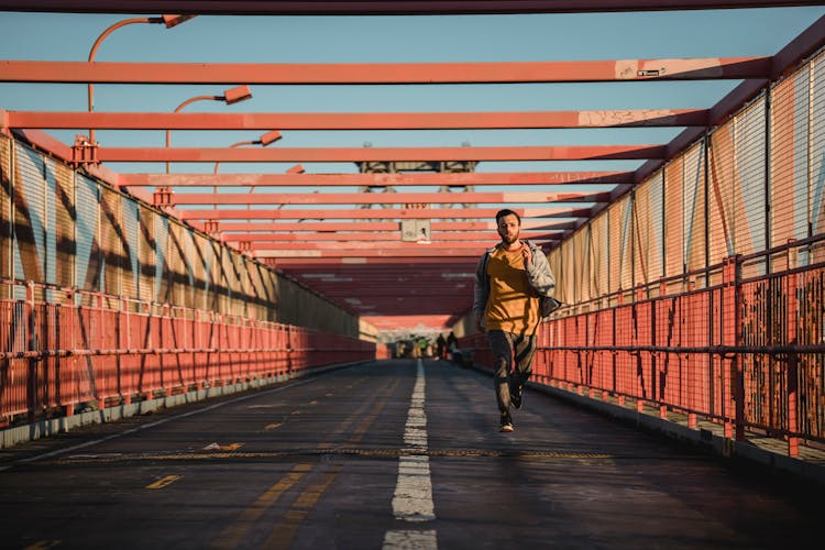 Fast Man Running On Bridge