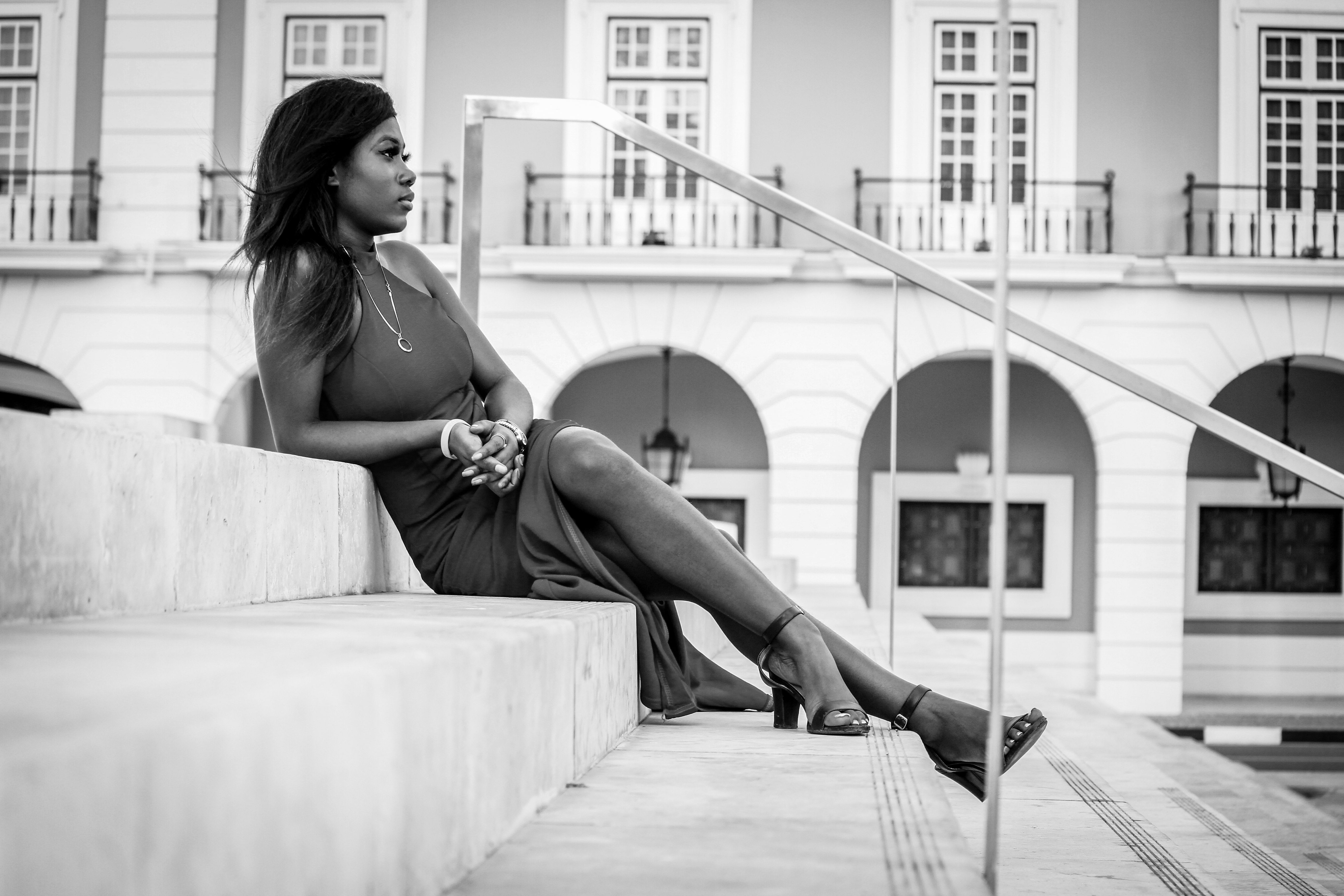 Serious black woman in stylish dress on stairs · Free Stock Photo