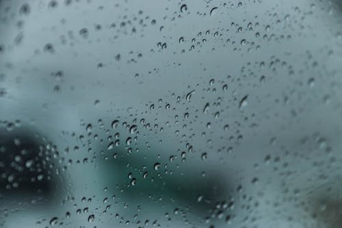 Free Close-Up Shot of Water Droplets on a Glass Window Stock Photo