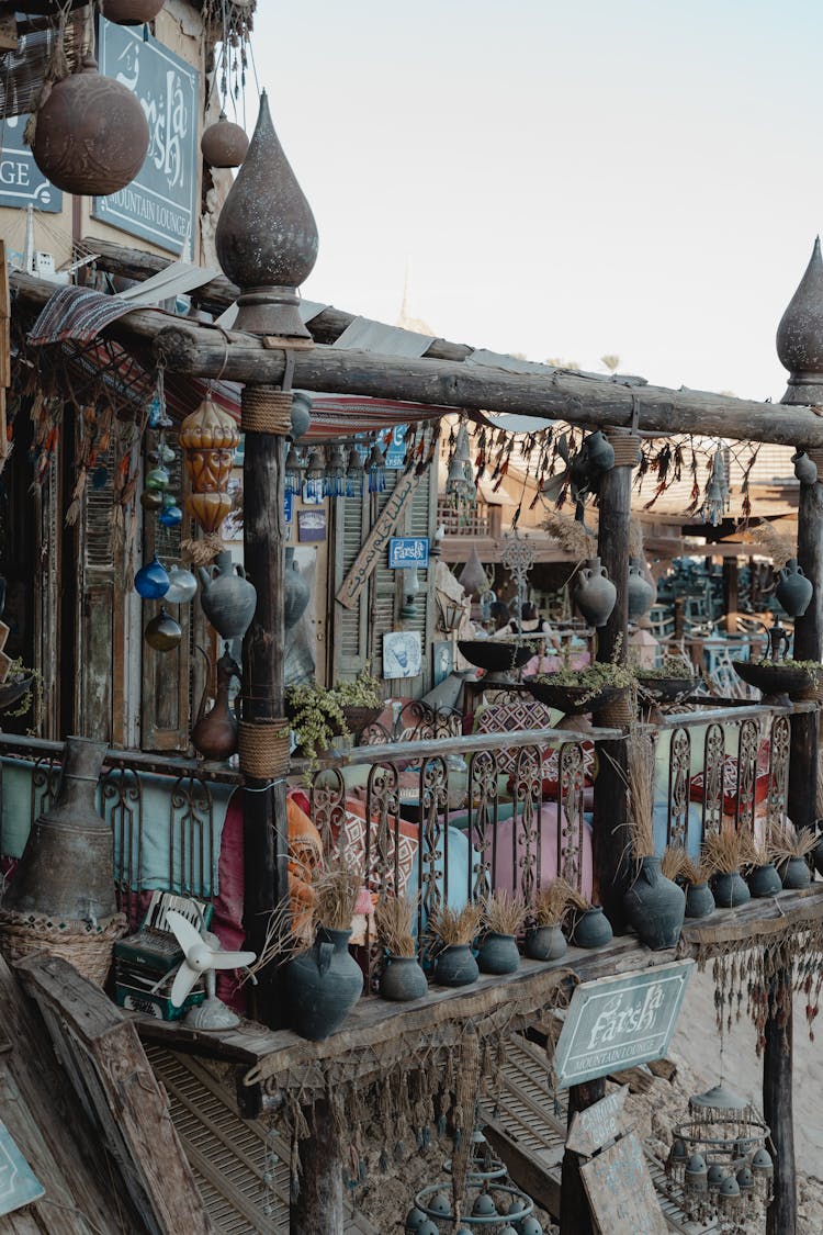 Cafe In Old Wooden Building Balcony With Pillows