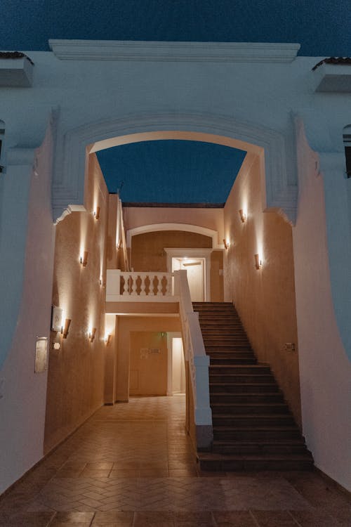 View of a Gateway and Stairs in a Hotel with White Exterior